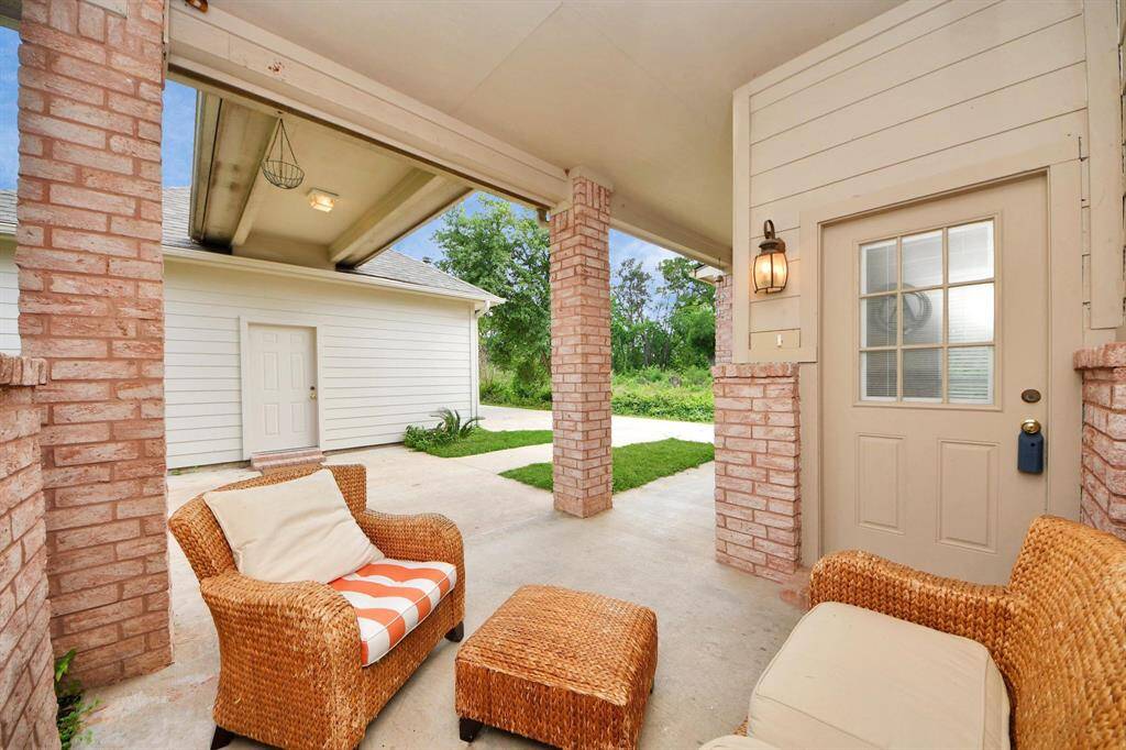 Just beyond the main living areas, a covered back patio offers the ideal space for outdoor relaxation and entertaining. Whether you're grilling, enjoying a quiet evening, or hosting friends and family, this patio seamlessly extends your living space outdoors. For extra convenience, it also connects directly to the garage, offering sheltered access and an easy transition between indoor and outdoor areas—rain or shine.