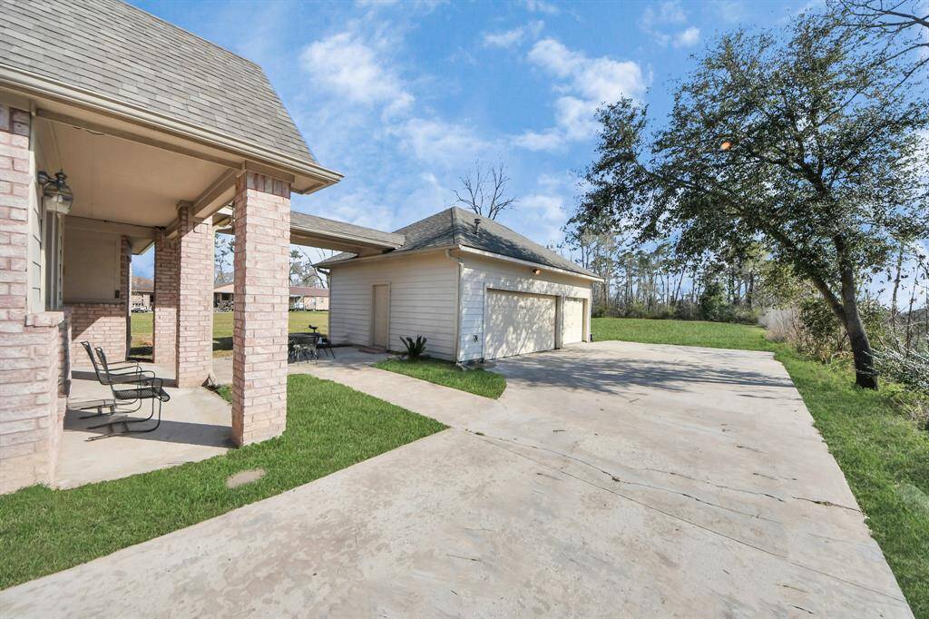 The rear porch adds a second outdoor living space that seamlessly blends with the home’s open-concept interior, making it ideal for entertaining or relaxing.