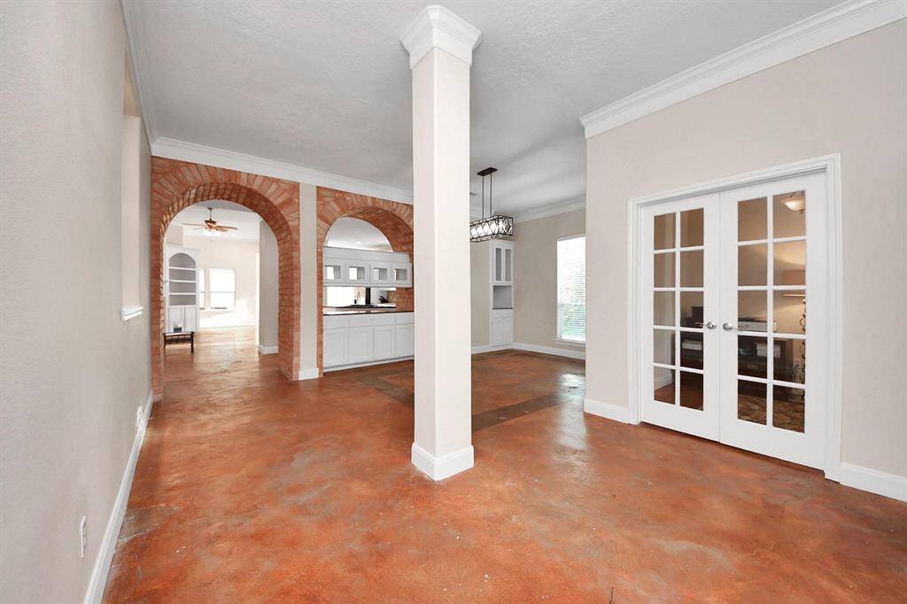 As you step through the elegant front door, you’re welcomed into a spacious and inviting entryway that sets the tone for the home’s thoughtful design and custom touches.