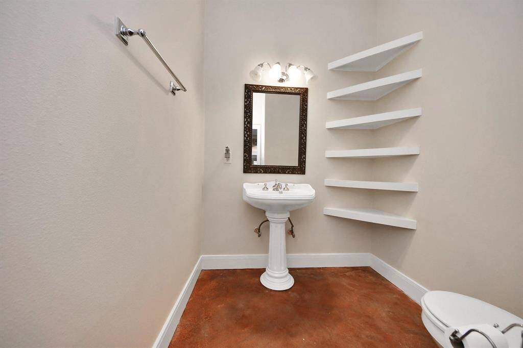 For added convenience, the home includes a stylish half bath located near the main living areas—perfectly positioned for guests. With modern fixtures and tasteful finishes, this powder room provides comfort and privacy without intruding on the home’s private bedroom spaces.