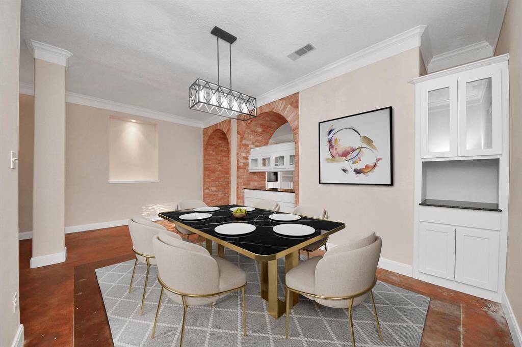 This space is elevated with custom built-in cabinetry, providing both elegance and functionality