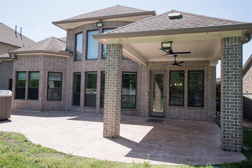 Large custom covered patio with imitation stone, perfect for entertaining