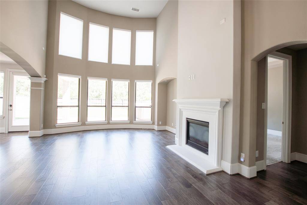 Large, light filled living area with a beautiful gas fireplace