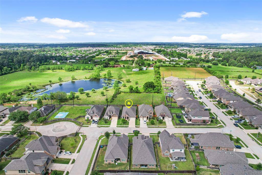 This aerial view captures the home nestled within the community, offering a broader perspective of its surroundings.