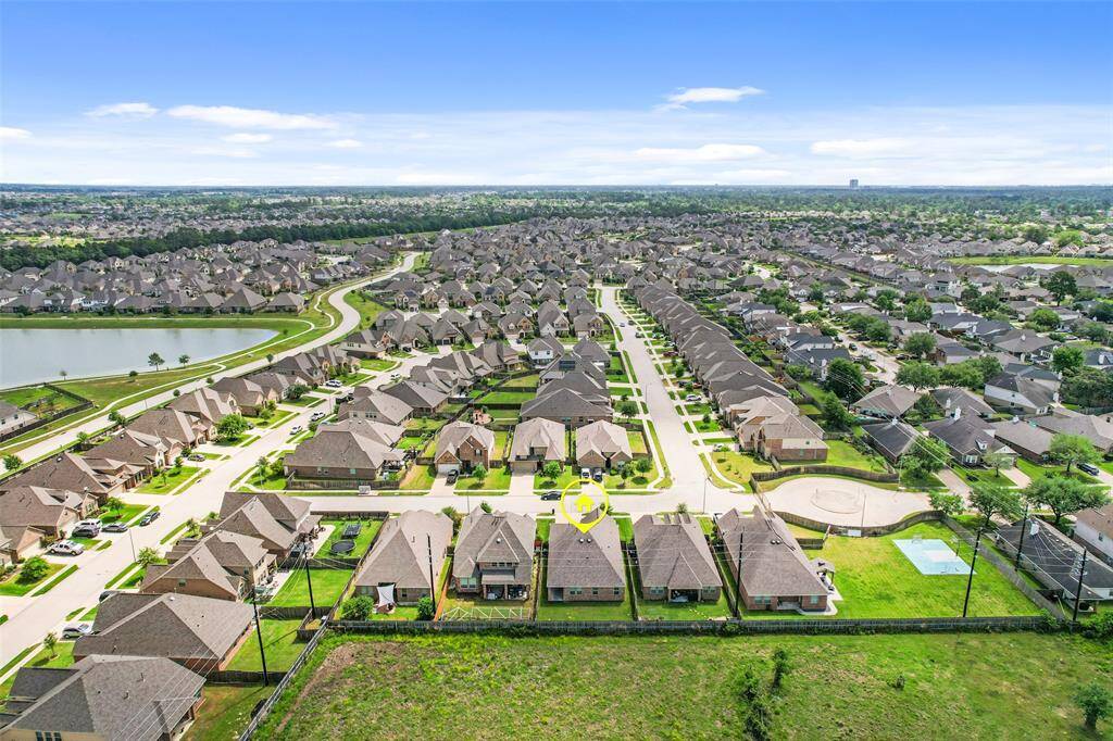 The rear aerial view offering an alternate look at the home and its community setting.