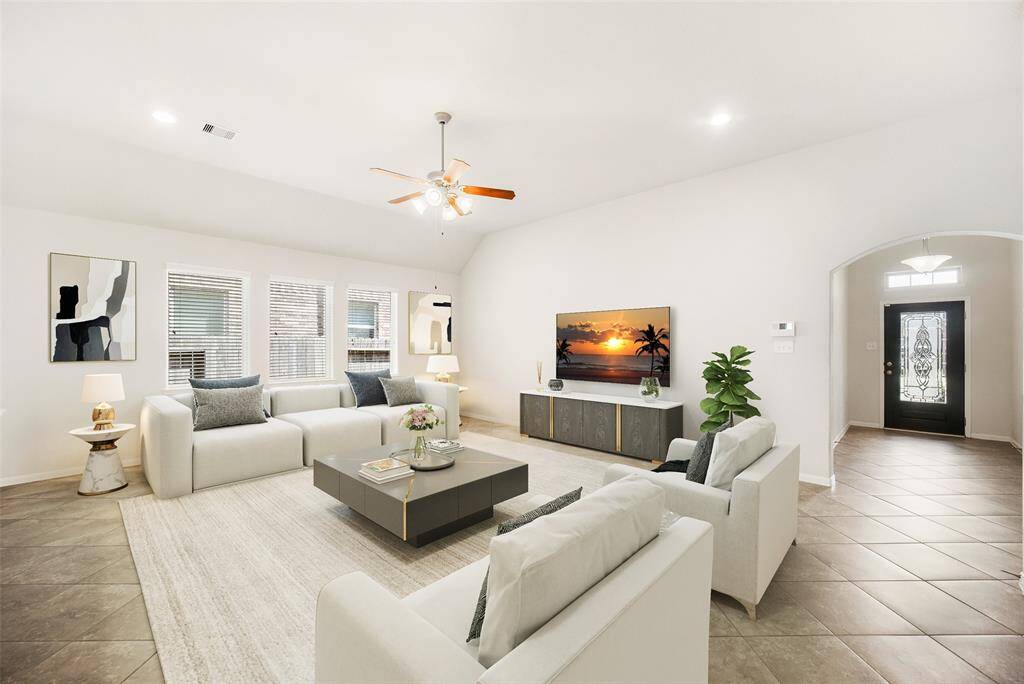 For reference, the family room has been virtually staged to showcase its full potential and functionality.