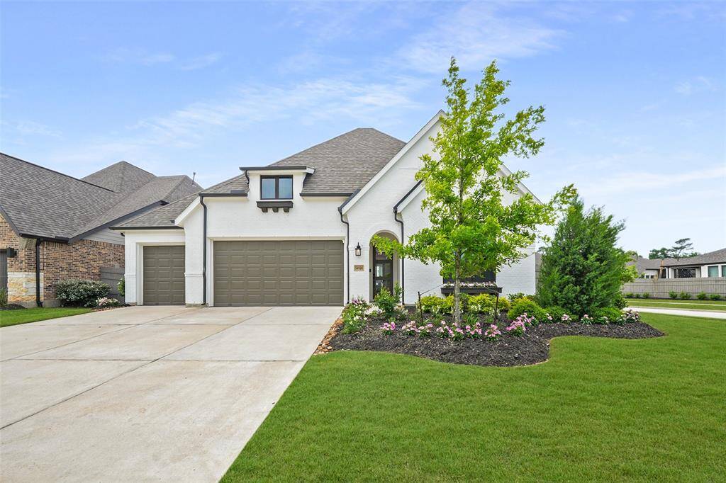 Stunning curb appeal with manicured landscaping and a welcoming entrance.