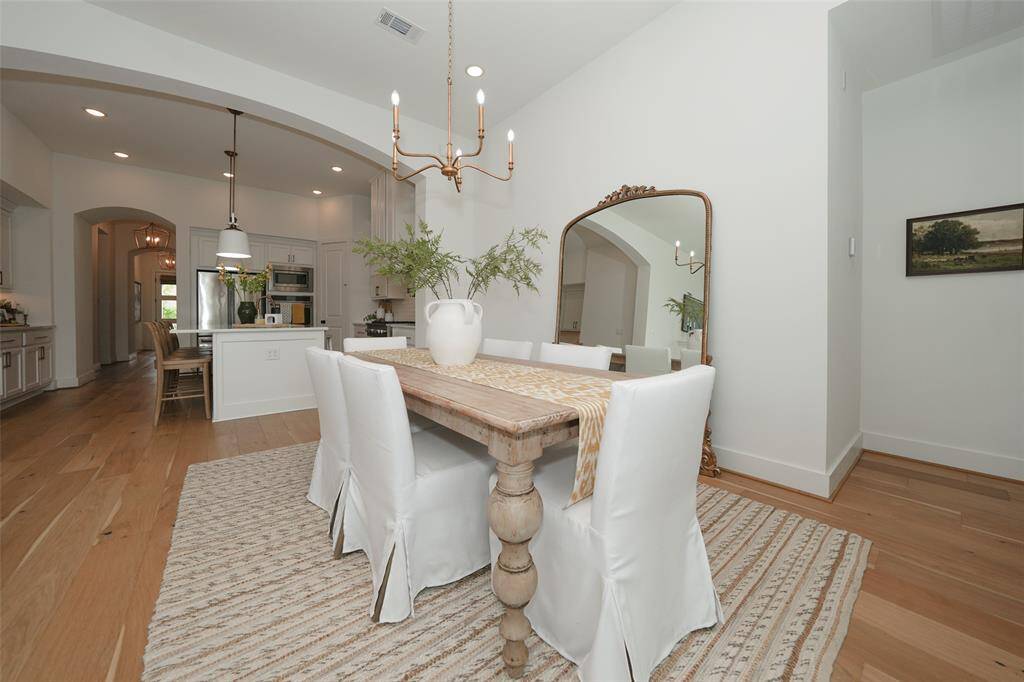 Elegant archway enhances the charm of the formal dining room.