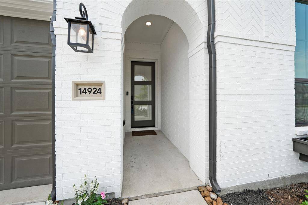 Welcoming entry with a modern doorbell camera for enhanced security.