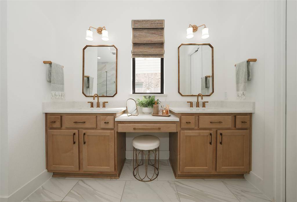 Elegant double vanity with ample storage and modern fixtures.