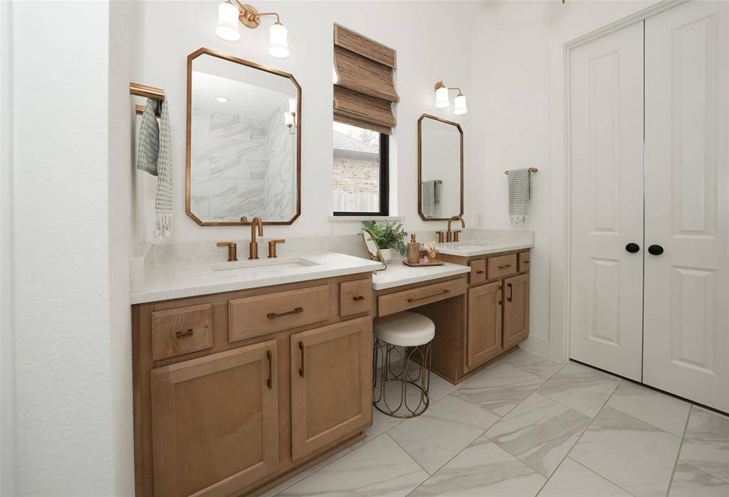 Elegant gold Moen hardware adds warmth and sophistication to the suite.
