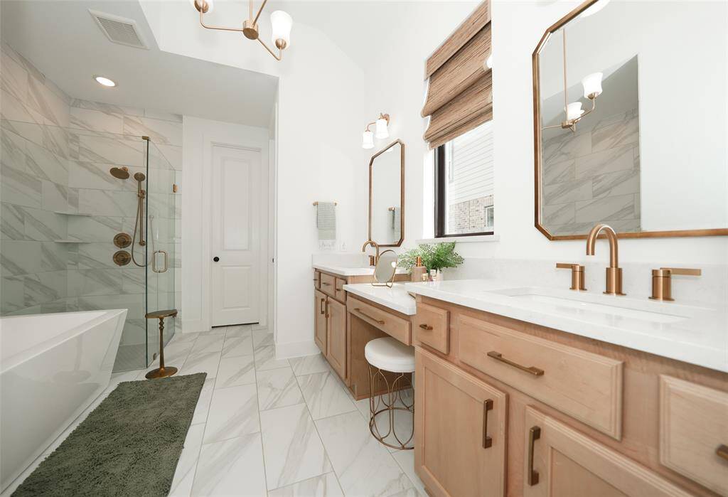 Enjoy the luxury of a spacious bath with a separate tub and shower.