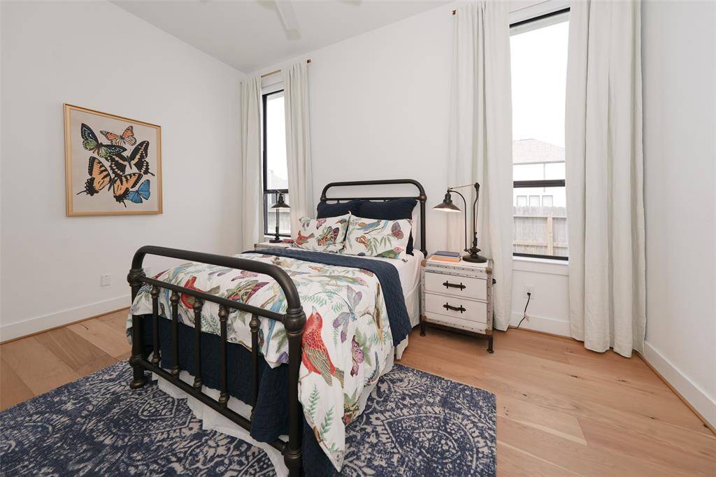 Cozy west-facing bedroom with convenient electric shades.