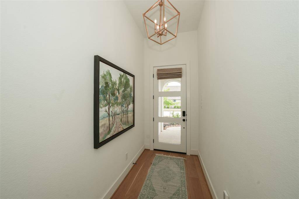 Lite wood floors and gold fixtures