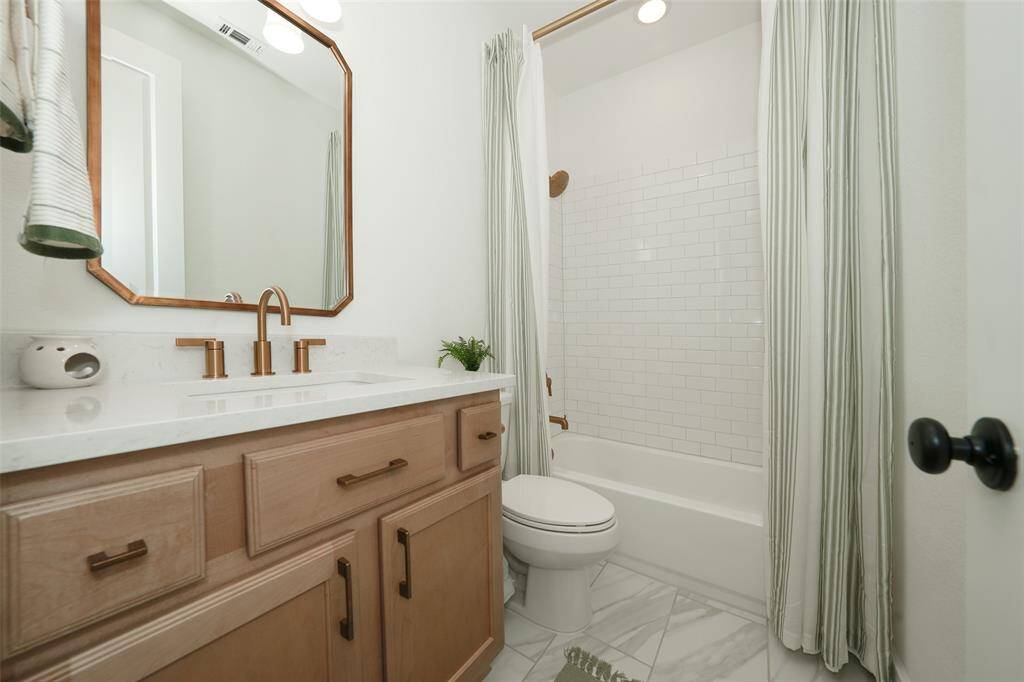 Elegant third full bathroom with modern fixtures and chic design.