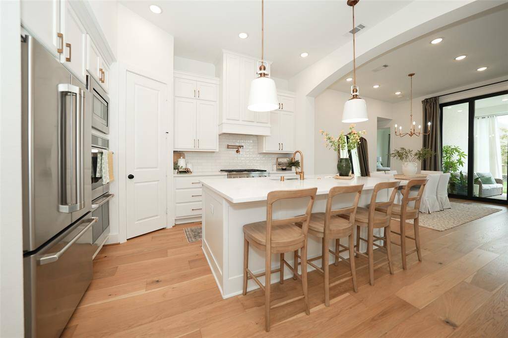 Seamlessly integrated kitchen and living area for effortless entertaining and connection.