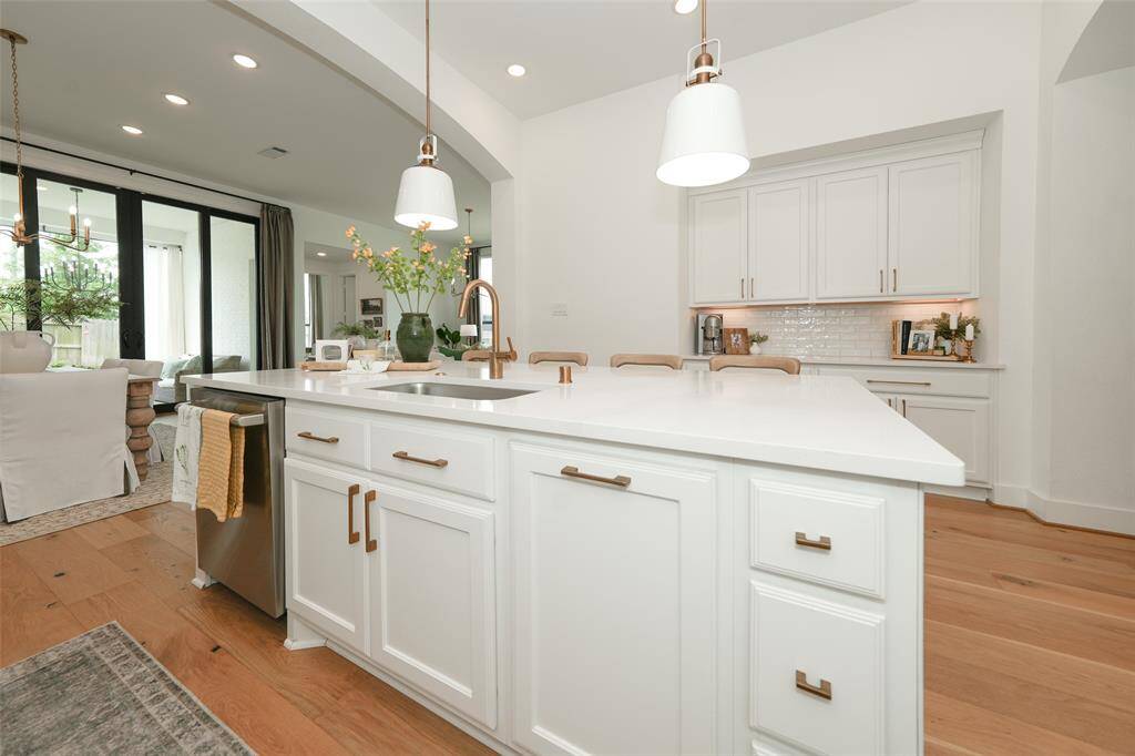 Elegant Moen sink and hardware enhance the kitchen's appeal.