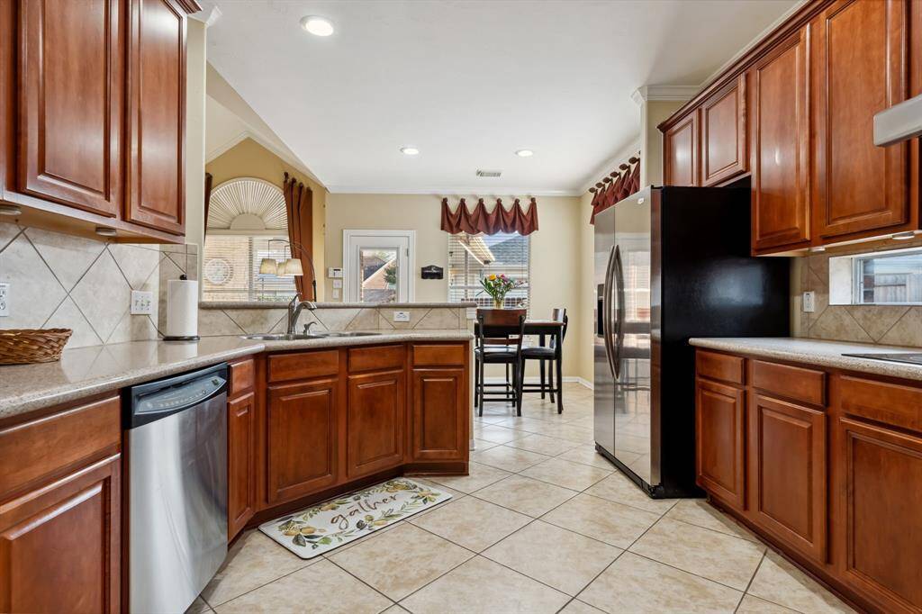 Kitchen offers a lot of counter space + an exceptional deep walk-in pantry!