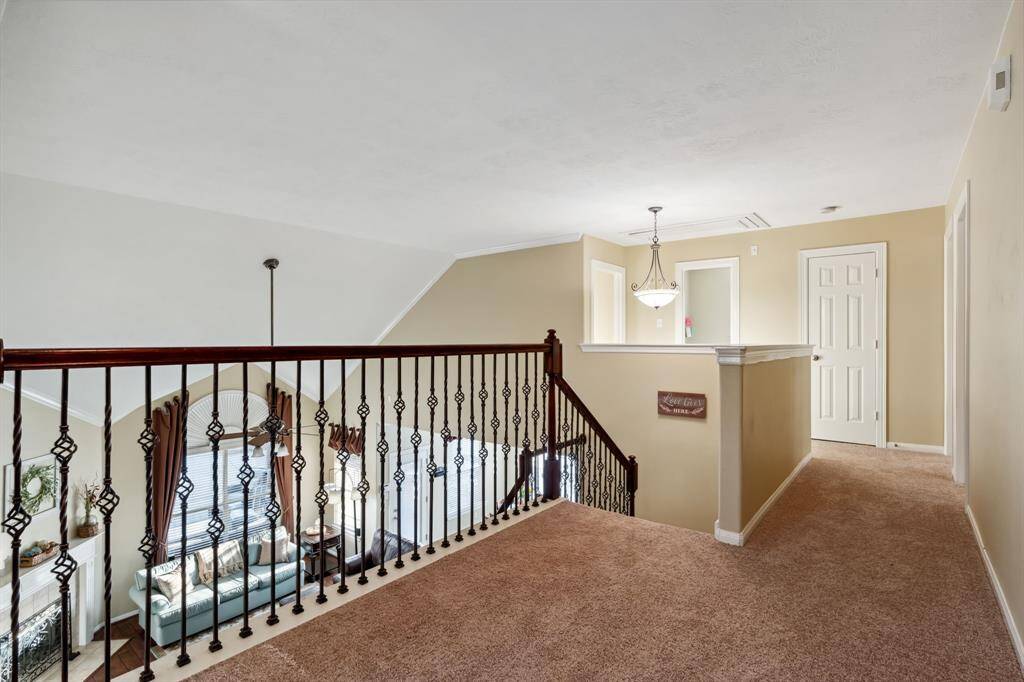 Upstairs hallway looks out over the family room.