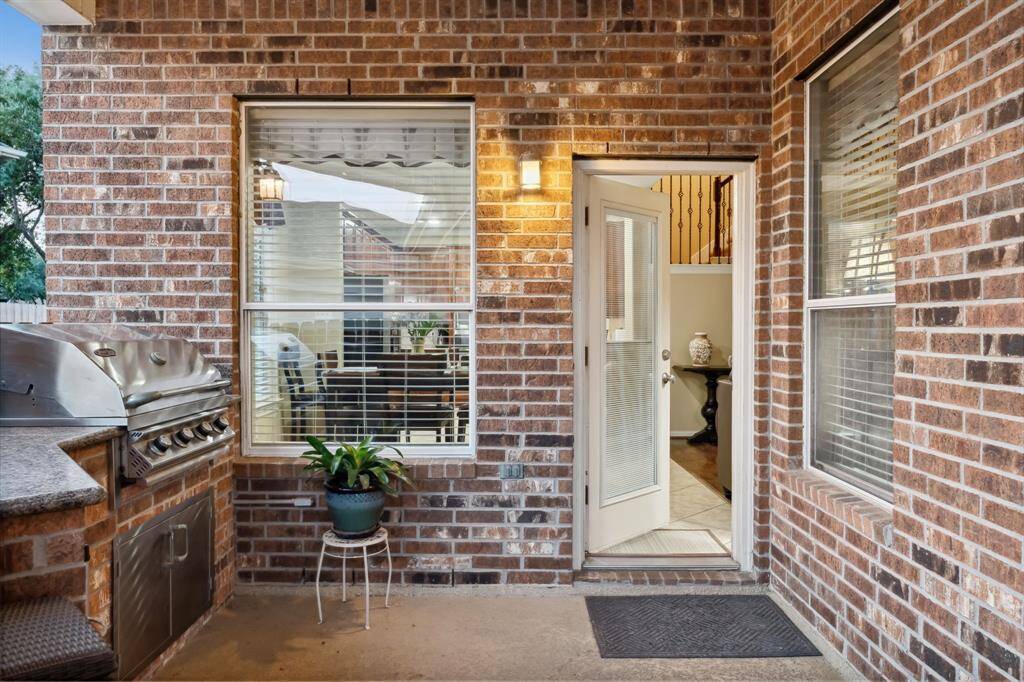 Outside the back door is a built in grill with counter space.
