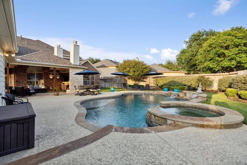 Full view of the length of the pool. Pool is deeper in the middle and shallower on each side.