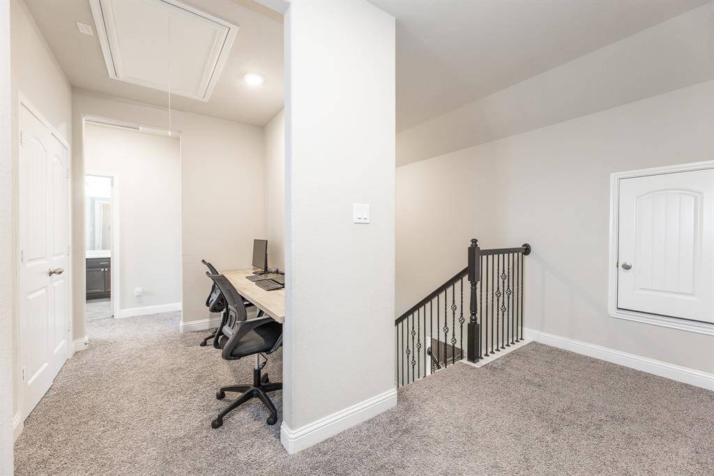This cozy upstairs functional area features plush carpet, extra storage room.