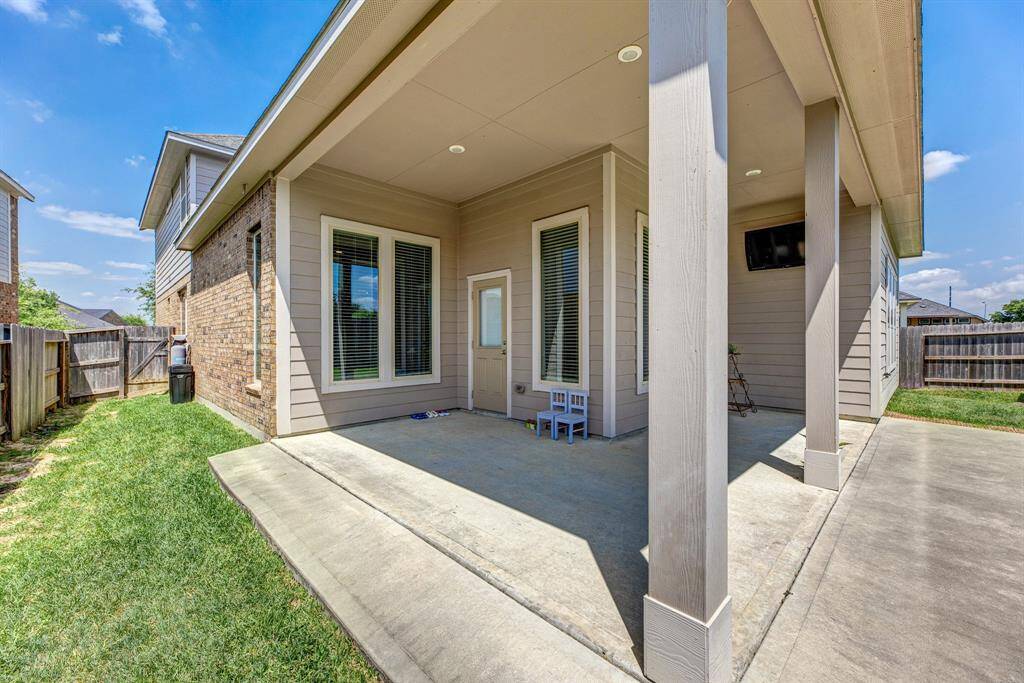 Extended covered patio and a spacious yard is perfect for your outdoor entertaining or relaxing