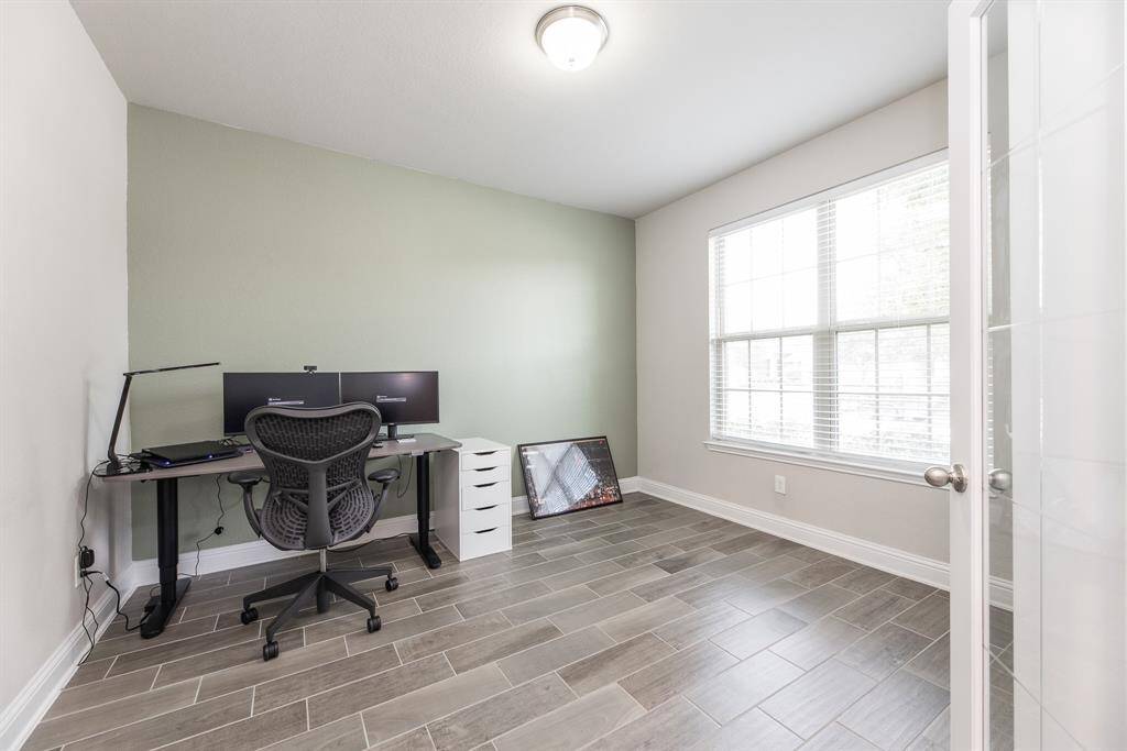 The home office features double doors for privacy.