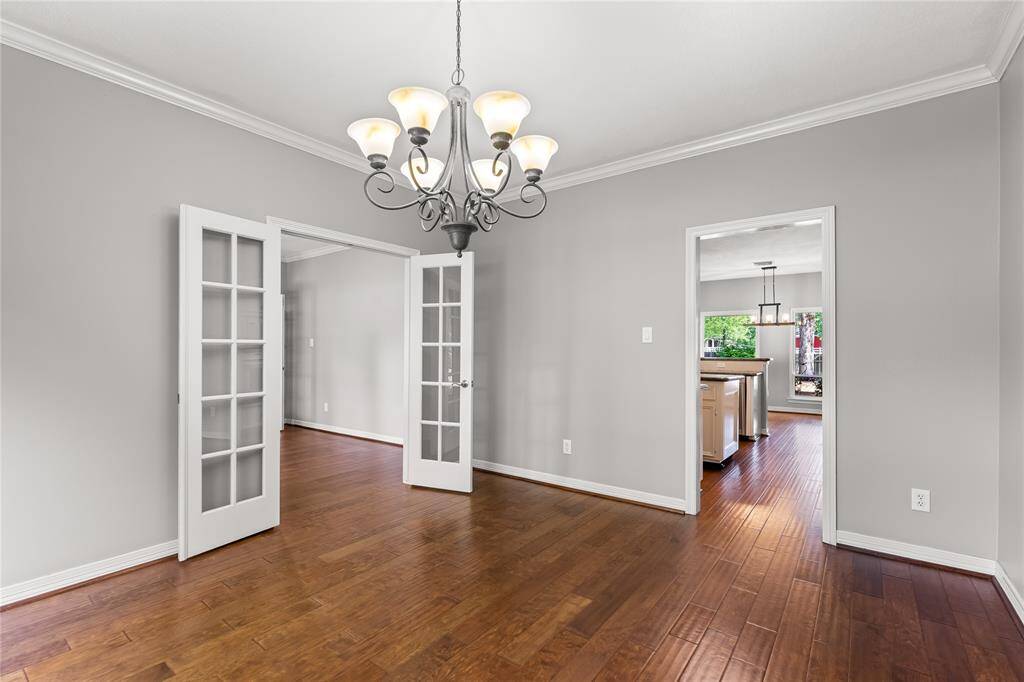 Formal dining with views of formal living and kitchen.