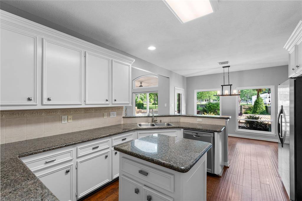 Tons of cabinet and counter space with views of breakfast room.