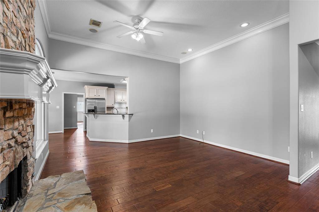 Den with views of kitchen area.