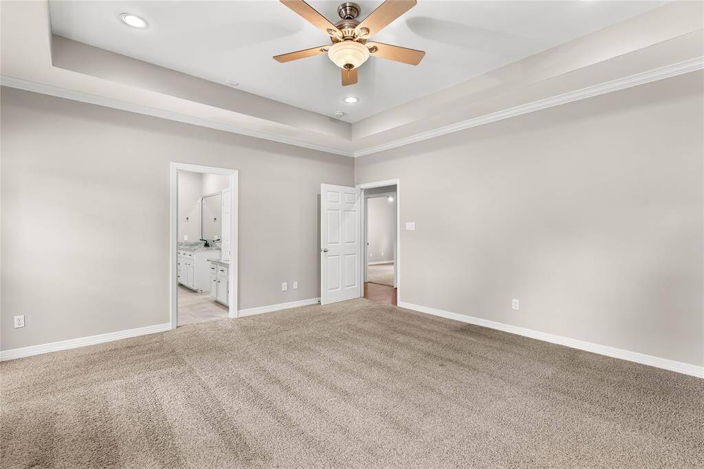 Another view of primary bedroom looking towards bathroom.