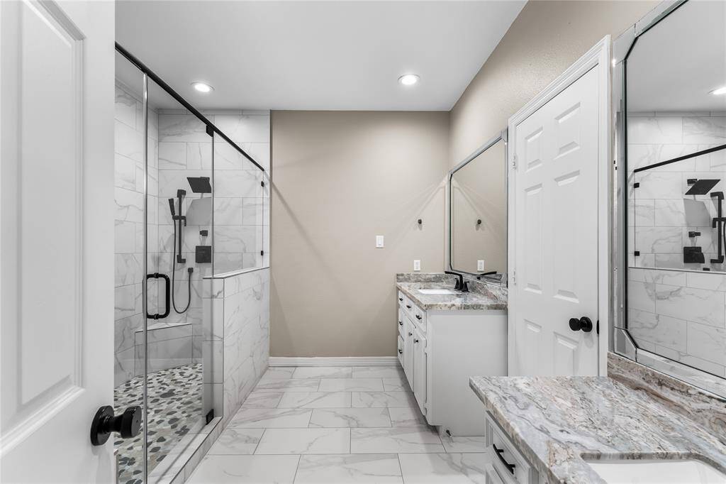 Updated primary bath with granite, dual sinks and oversized shower!