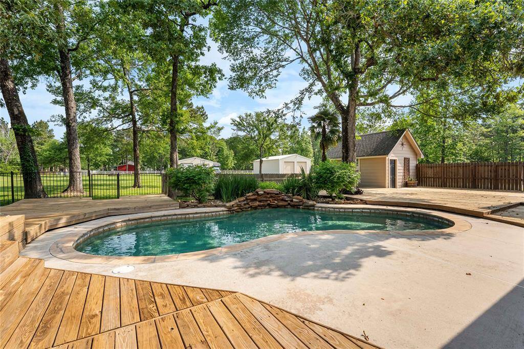 Pool with views of storage shed.