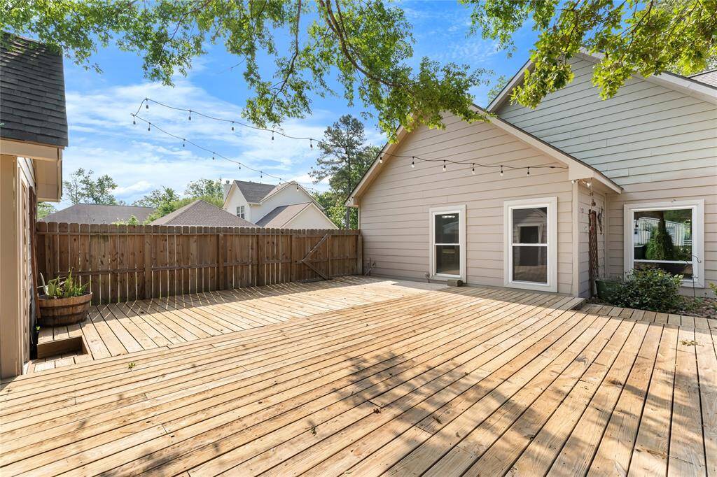 Decking between home and storage shed.