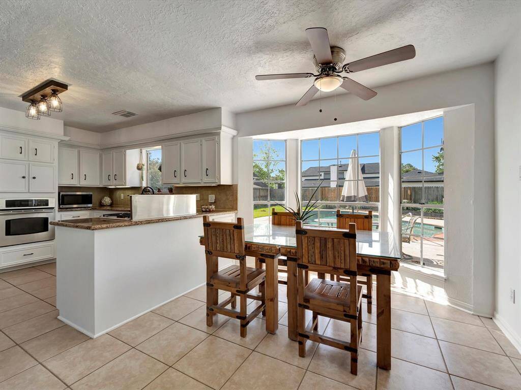 Bay window overlooks pool.