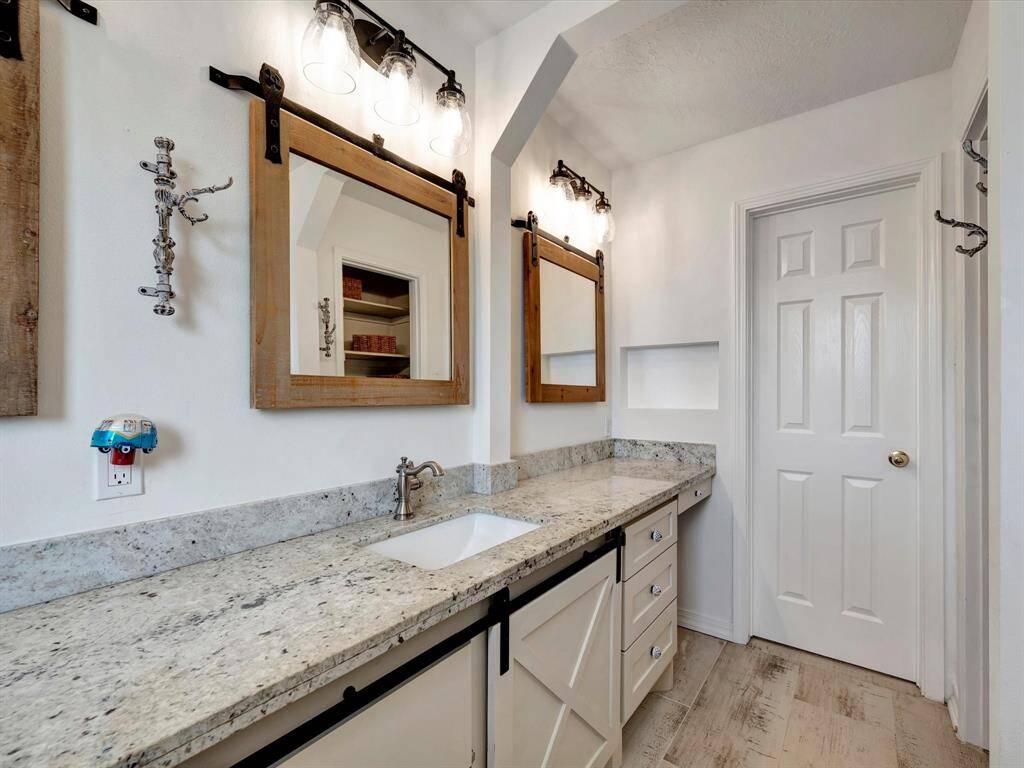 Beautifully updated primary bathroom with double sinks.