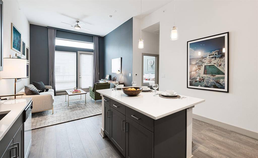 Photos are of a similar 1 bedroom plan model. All finishes are the same (except the accent walls which you can paint with permission and revert back to white at move out). Note the ceiling heights! 12 ft on this top floor unit