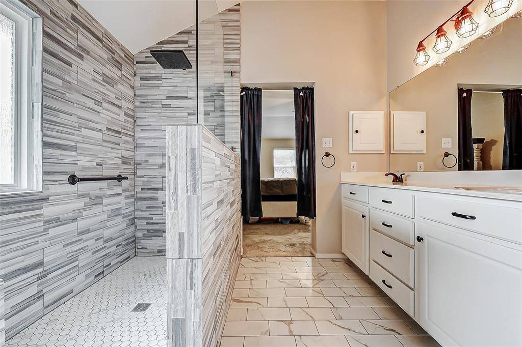 This marvelous primary ensuite restroom - must see.