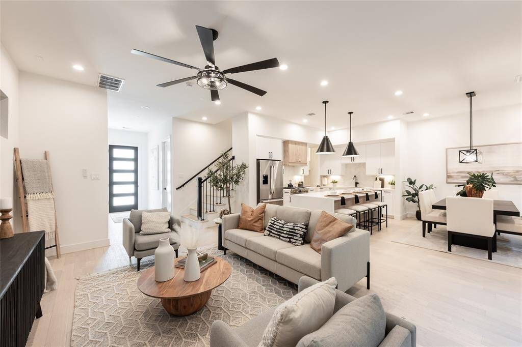 Designed for modern living, this open-concept space seamlessly integrates the living, kitchen, and dining areas, creating an inviting and expansive atmosphere.