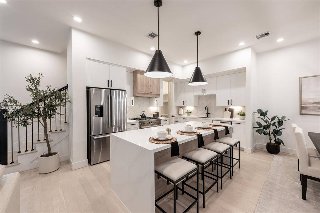 A chef’s dream, this kitchen is a statement of modern luxury with high-end appliances and bespoke cabinetry.