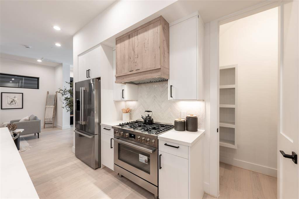 Built with precision and care, every element of this kitchen reflects impeccable craftsmanship and design, including the large walk-in pantry.