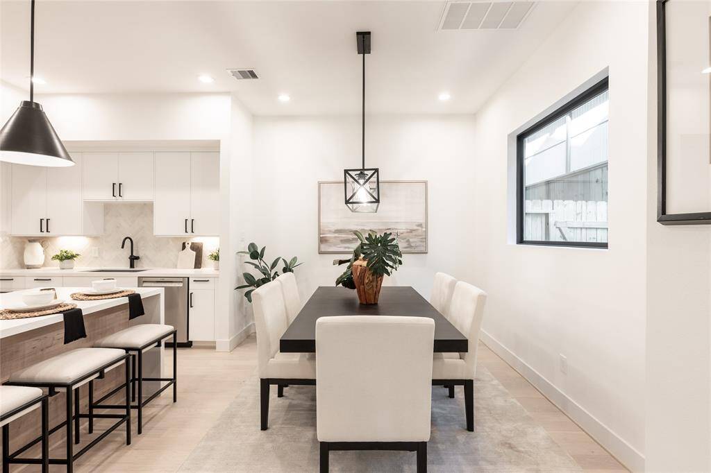 Framed by modern lighting and a neutral palette, this space embodies effortless elegance.