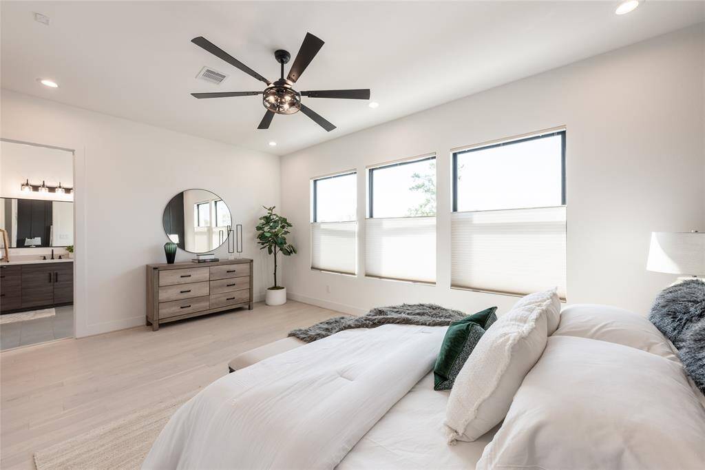 A perfect balance of modern elegance and warmth, this bedroom serves as a private escape within the home.