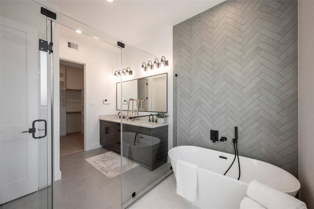 Designed for ultimate comfort, this primary bath is a masterclass in refined architectural detailing.