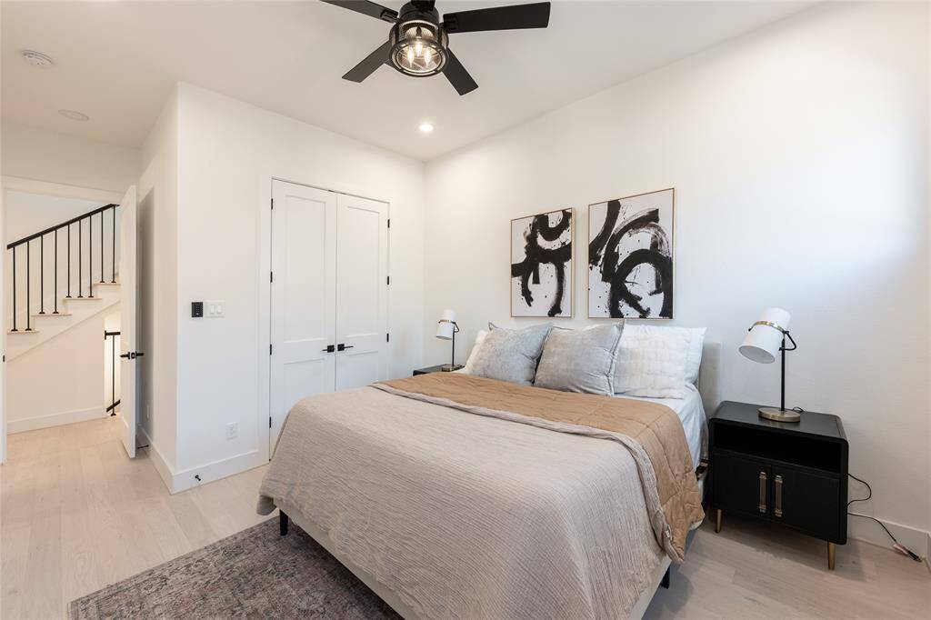 Architectural detailing and designer lighting enhance the overall aesthetic of this restful space.