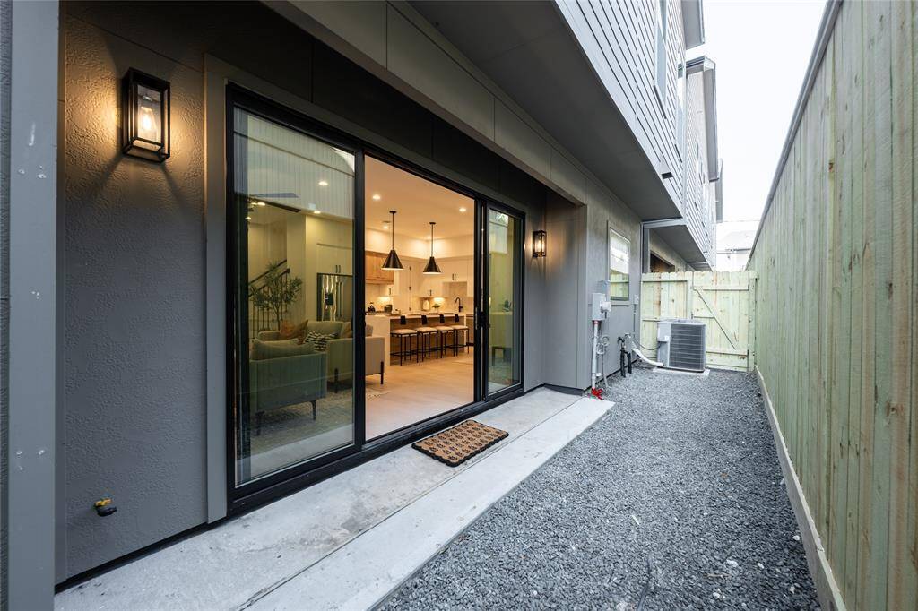 The outdoor patio features a oversized double sliding doors that allows both elements of indoor and outdoor to be enjoyed simultaneously.