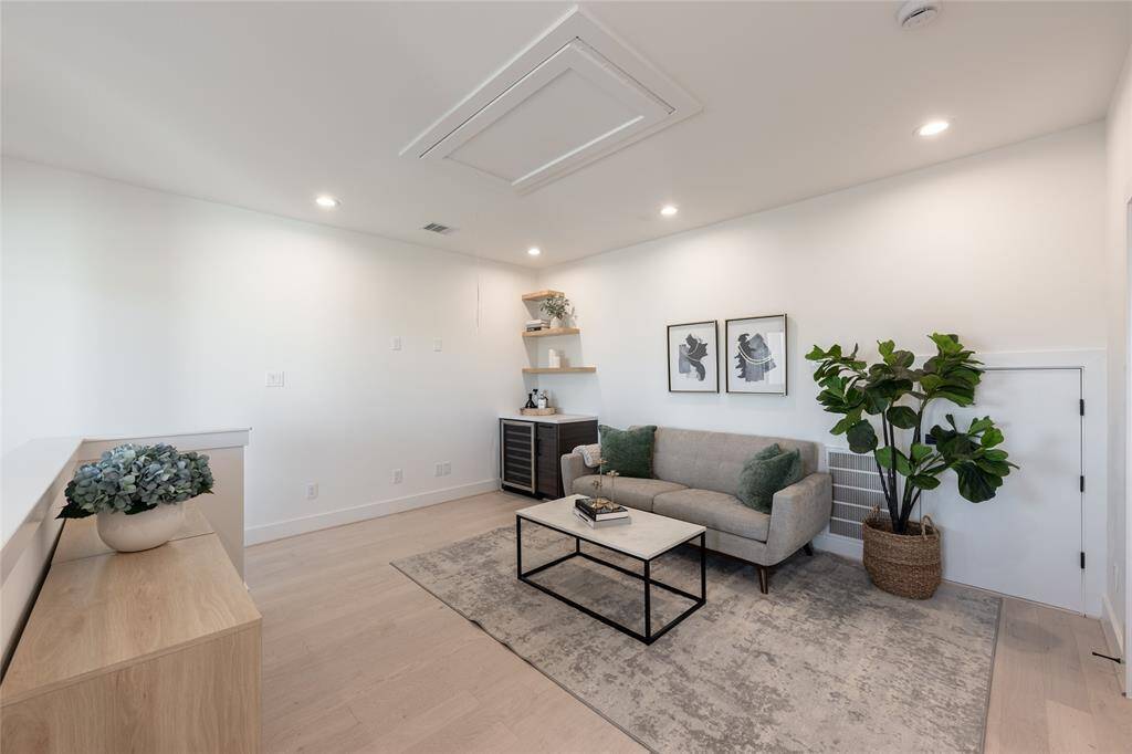 A versatile retreat, this upstairs living area offers endless possibilities, from a media lounge to a stylish home office.