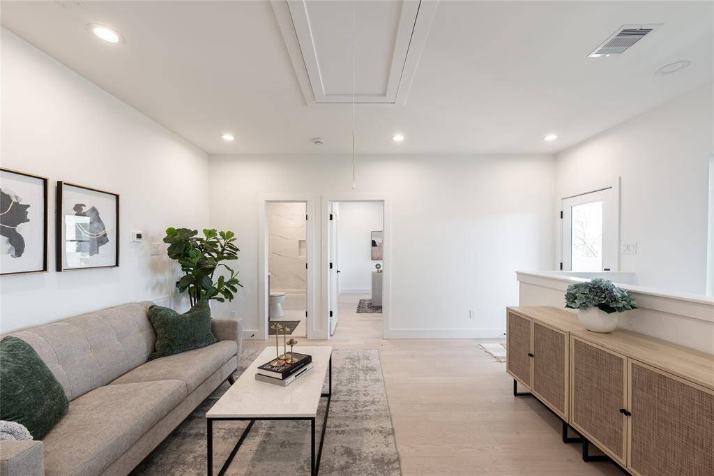 Whether used for work or leisure, this additional living space serves as an extension of the home’s refined aesthetic.