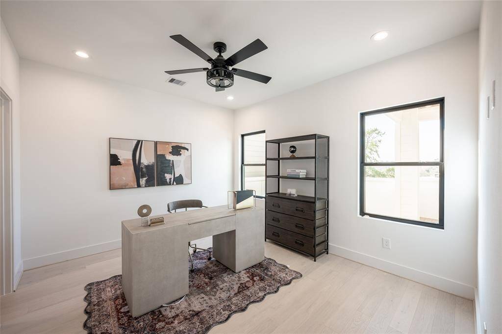 Designed with flexibility in mind, this room serves as an ideal home office or a stylish guest retreat.
